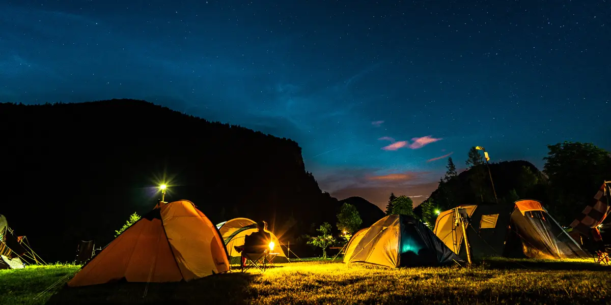 Tents set up under a beautiful clear night sky