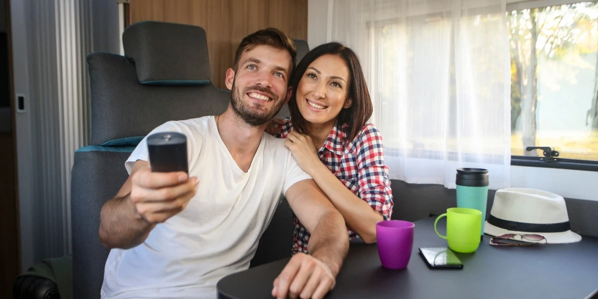 A couple watching a movie in their RV