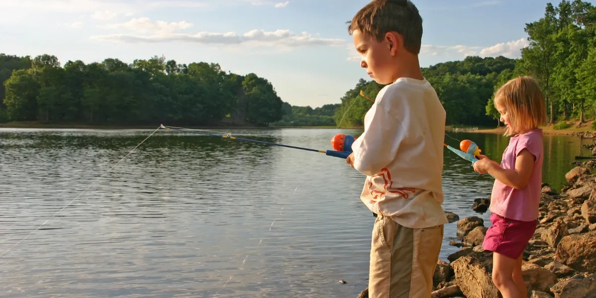 Children fishing at the lake