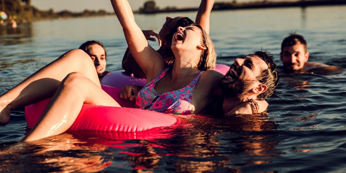 Friends enjoying a swim at the lake