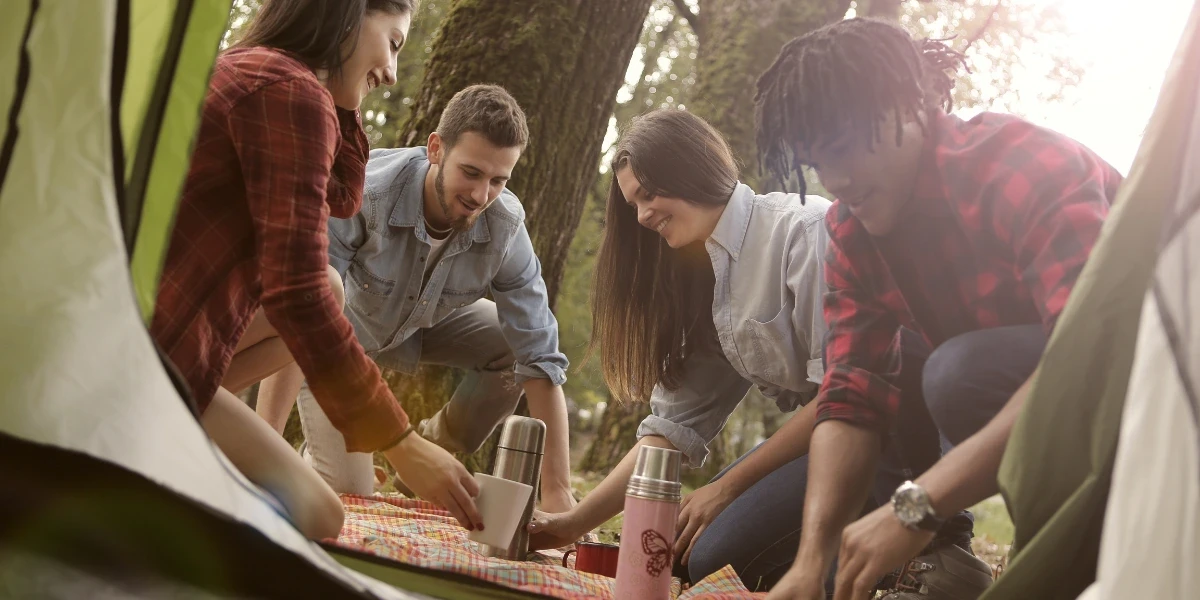 Friends having a picnic in the forest