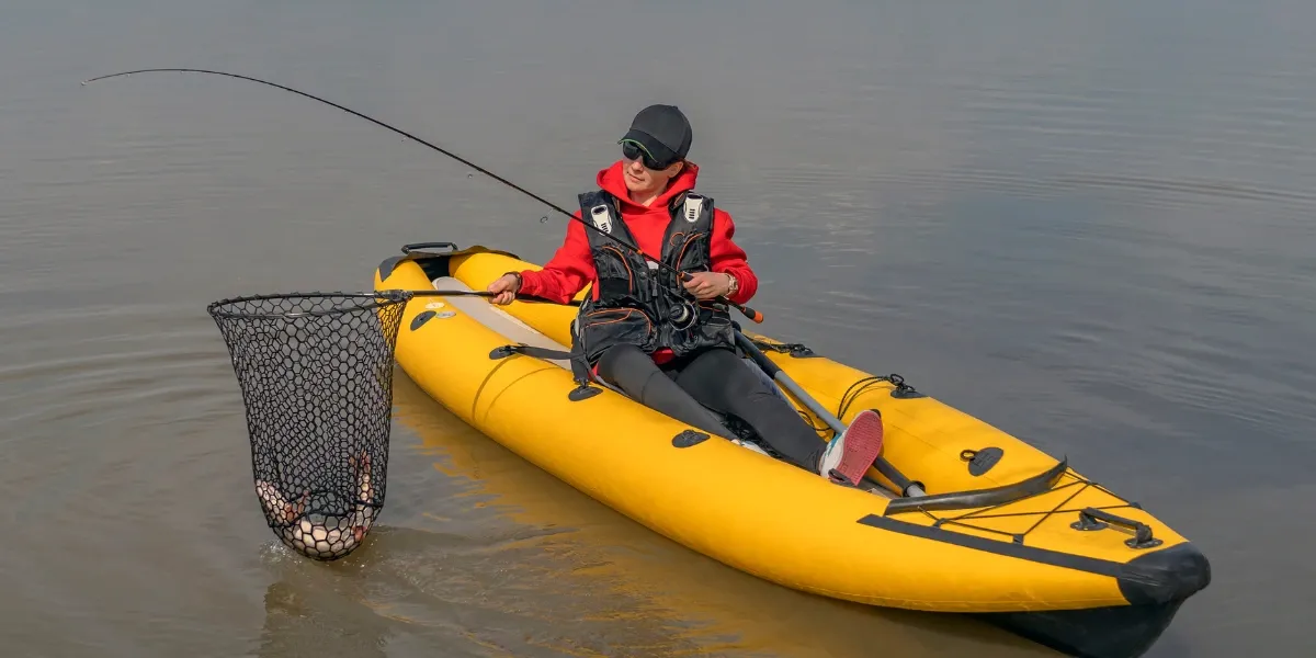 Man in kayak fishing for pike