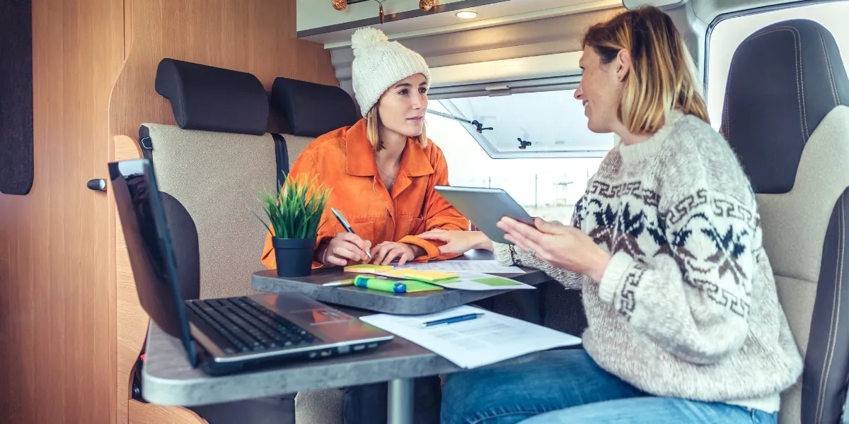 Two women telecommuting from an RV