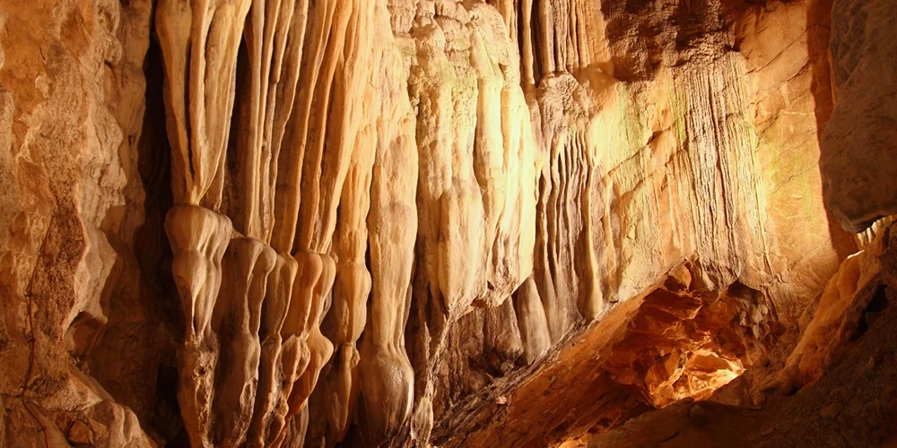 Underground cavern with cave stalactites