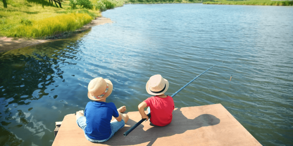 Kids fishing by the lake