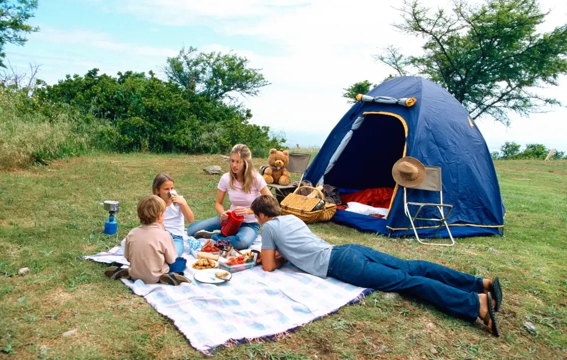 An image of a family camping outdoors.