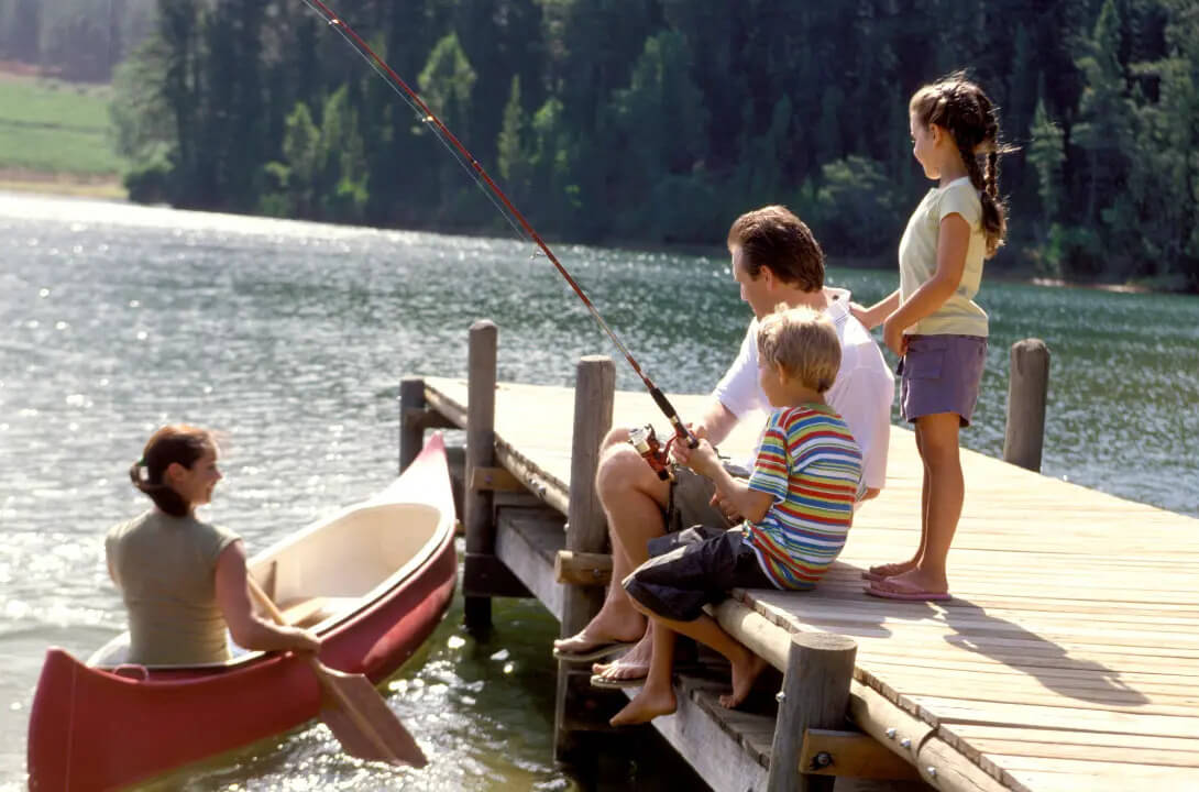 A family fishing at the lake