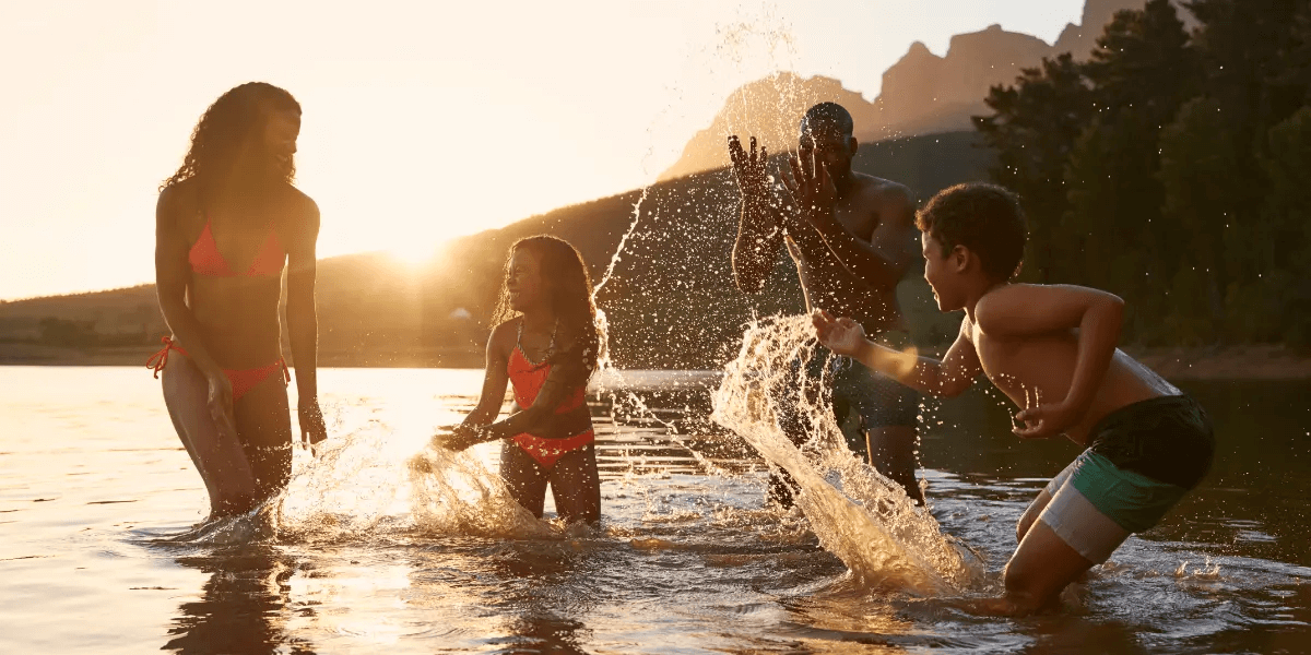 A family enjoying a swim at the lake